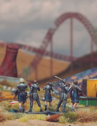 A group of Raider miniatures looking out at Nuka World in Fallout: Factions.