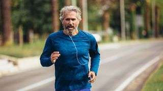 Man out running listening to music