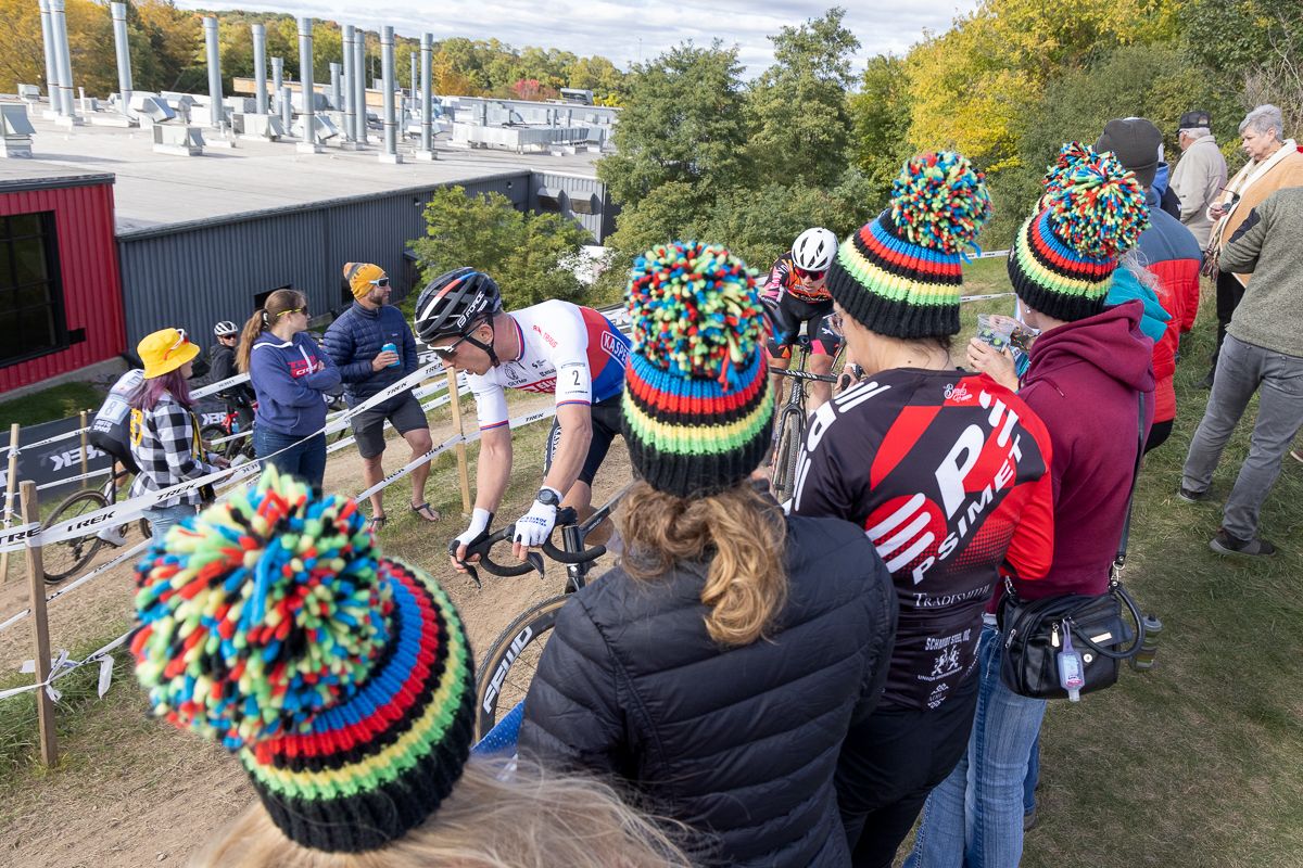 Fans cheer on Michael Boros (Elkov Kasper Czech Cycling Team) as he drops down towards the base of Factory Hill.