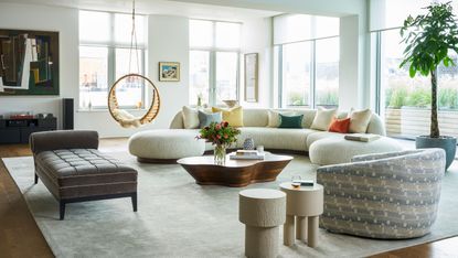 Living room with curved furniture and rug