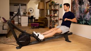 Man rows on Hydrow Wave in an aspirational NYC apartment