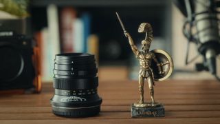 ZY Optics Pittura 30mm f/2.4 lens against a white background