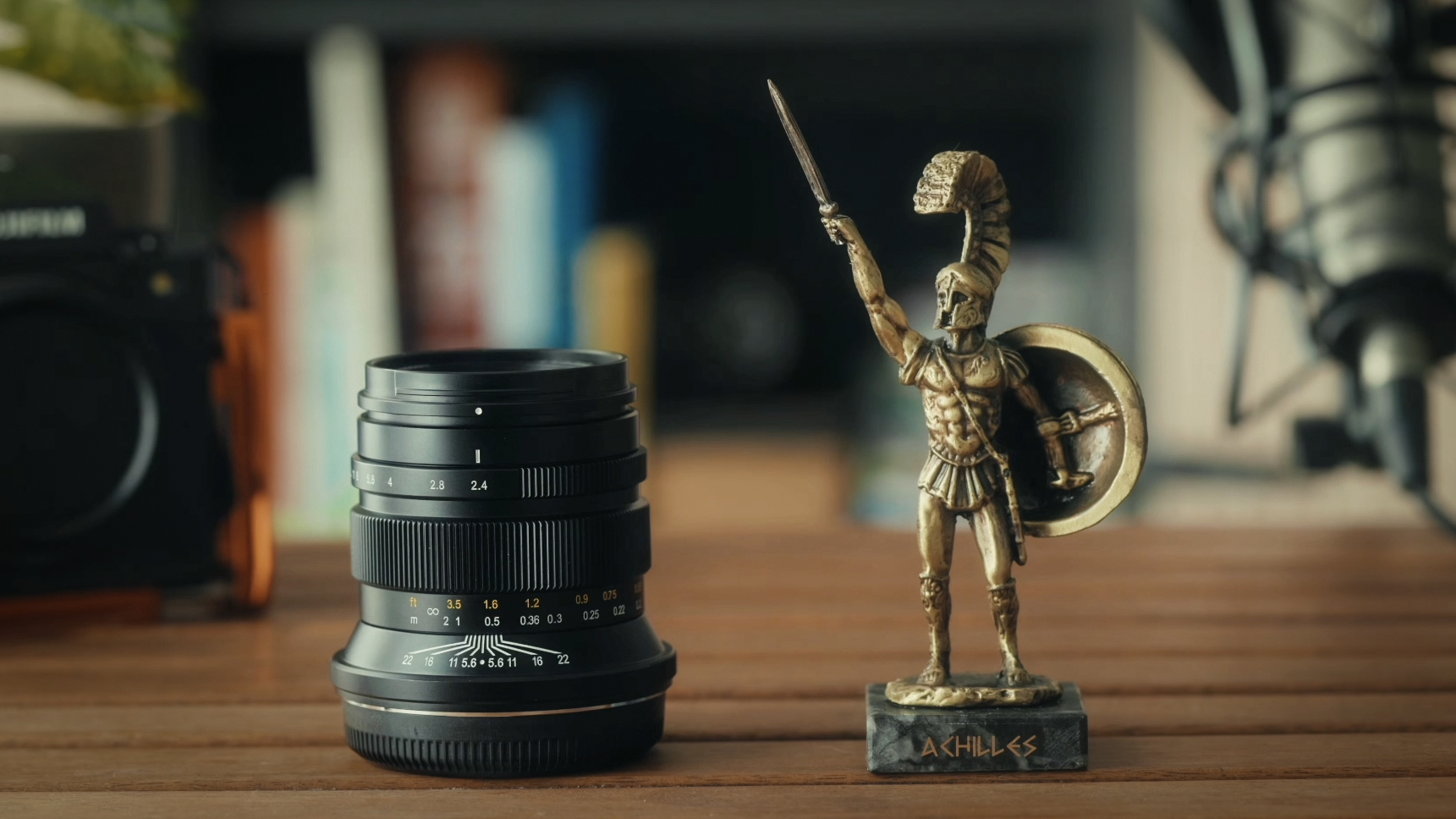ZY Optics Pittura 30mm f/2.4 lens against a white background