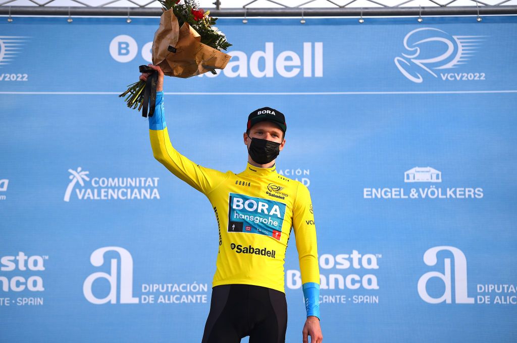 ALTO DE LAS ANTENAS DEL MAIGMO TIBI ALICANTE SPAIN FEBRUARY 04 Aleksander Vlasov of Russia and Teamm Bora Hansgrohe celebrates at podium as Yellow Leader Jersey winner during the 73rd Volta A La Comunitat Valenciana 2022 Stage 3 a 1551km stage from Alicante to Alto De Las Antenas Del Maigmo Tibi 1080m VCV2022 on February 04 2022 in Alicante Spain Photo by Dario BelingheriGetty Images