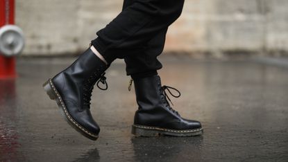 Anna Siepenkötter wearing black H&M trackpants and black Dr. Martens boots on March 13, 2021 in Berlin, Germany.