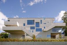 Concrete House is sited beside a lake and looks out towards Hamar and Domkirkeodden