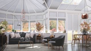 a conservatory with lots of lighting ideas and blinds