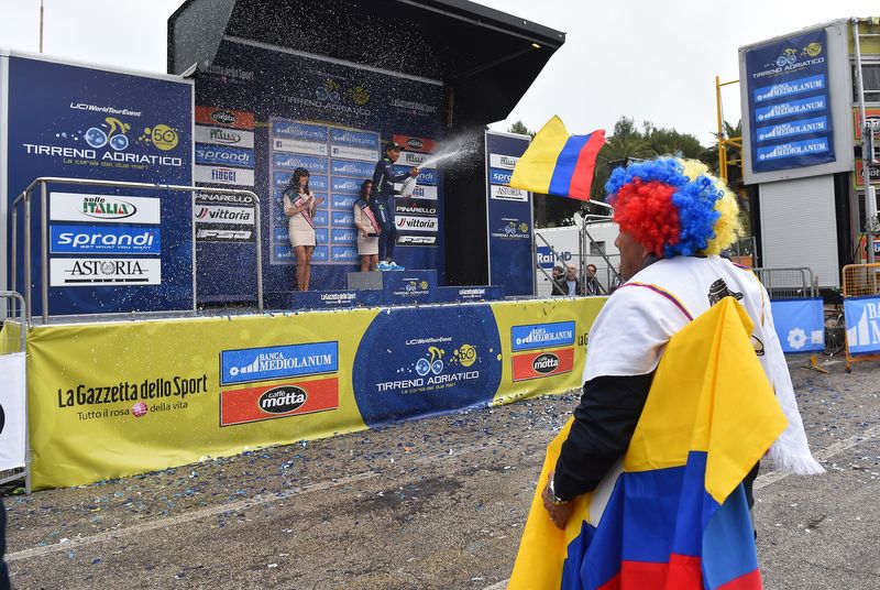 A Colombian fan watches the final podium ceremony