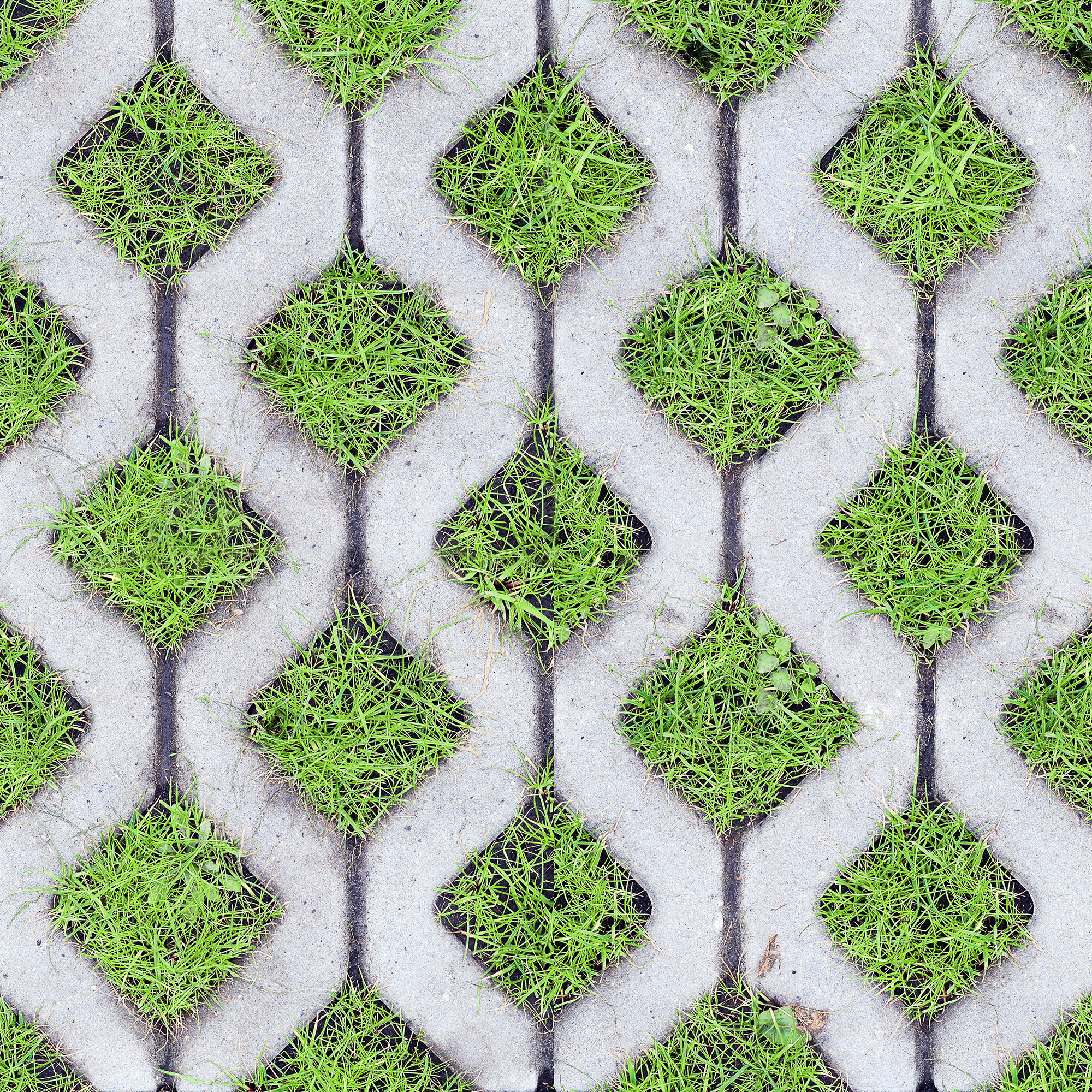 Top view of eco-friendly parking of concrete cells and turf grass as a seamless pattern