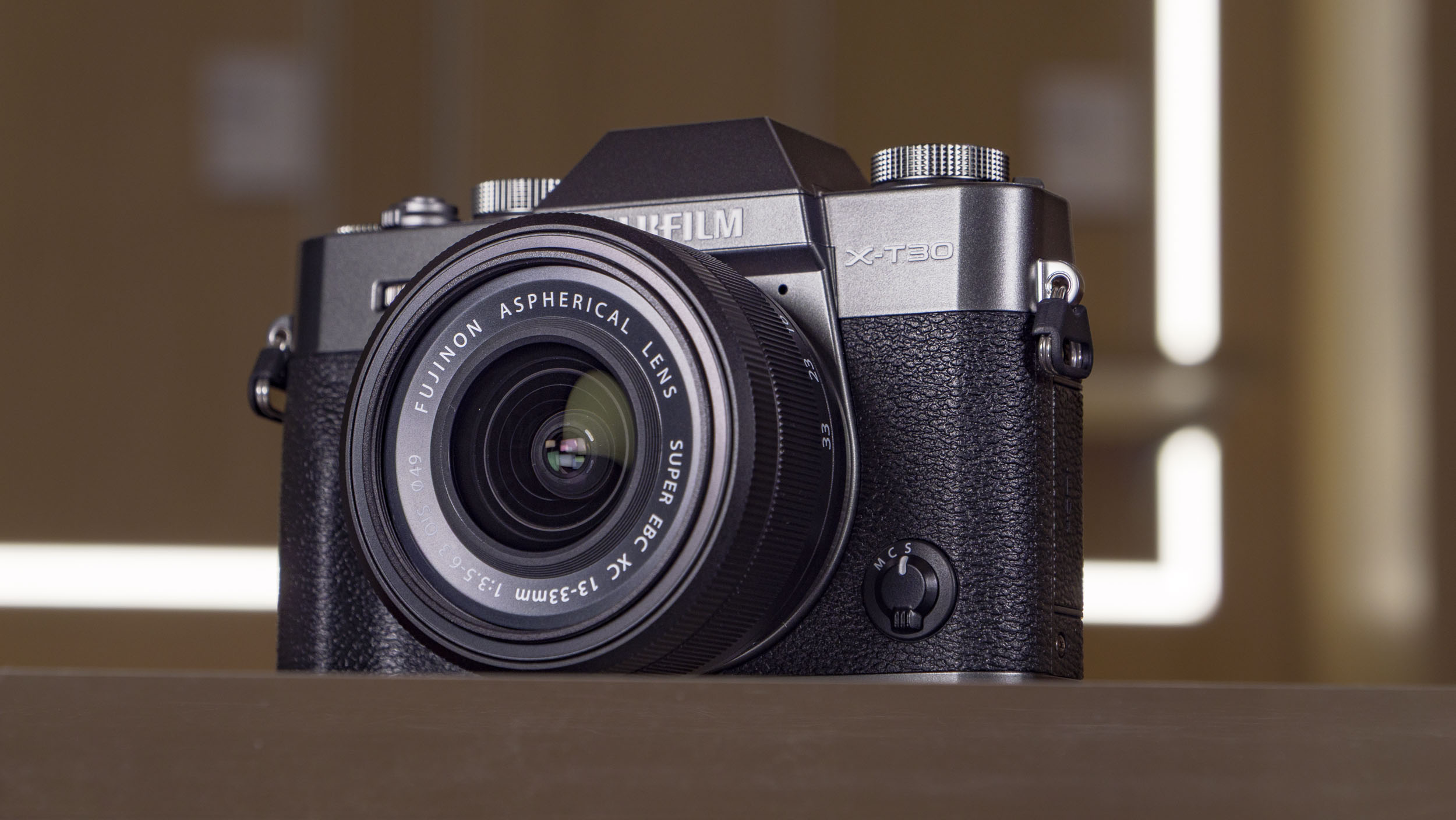 Fujifilm X-T30 III camera on a glass table