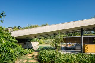 Roof touching the ground at Casa Colina by FGMF