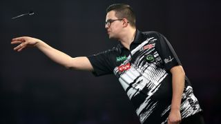 Gian van Veen of the Netherlands throws against Charlie Manby of England during the Round Four match between Charlie Manby and Gian van Veen on day seventeen of the 2025/26 Paddy Power World Darts Championship at Alexandra Palace on December 30, 2025 in London, England. 
