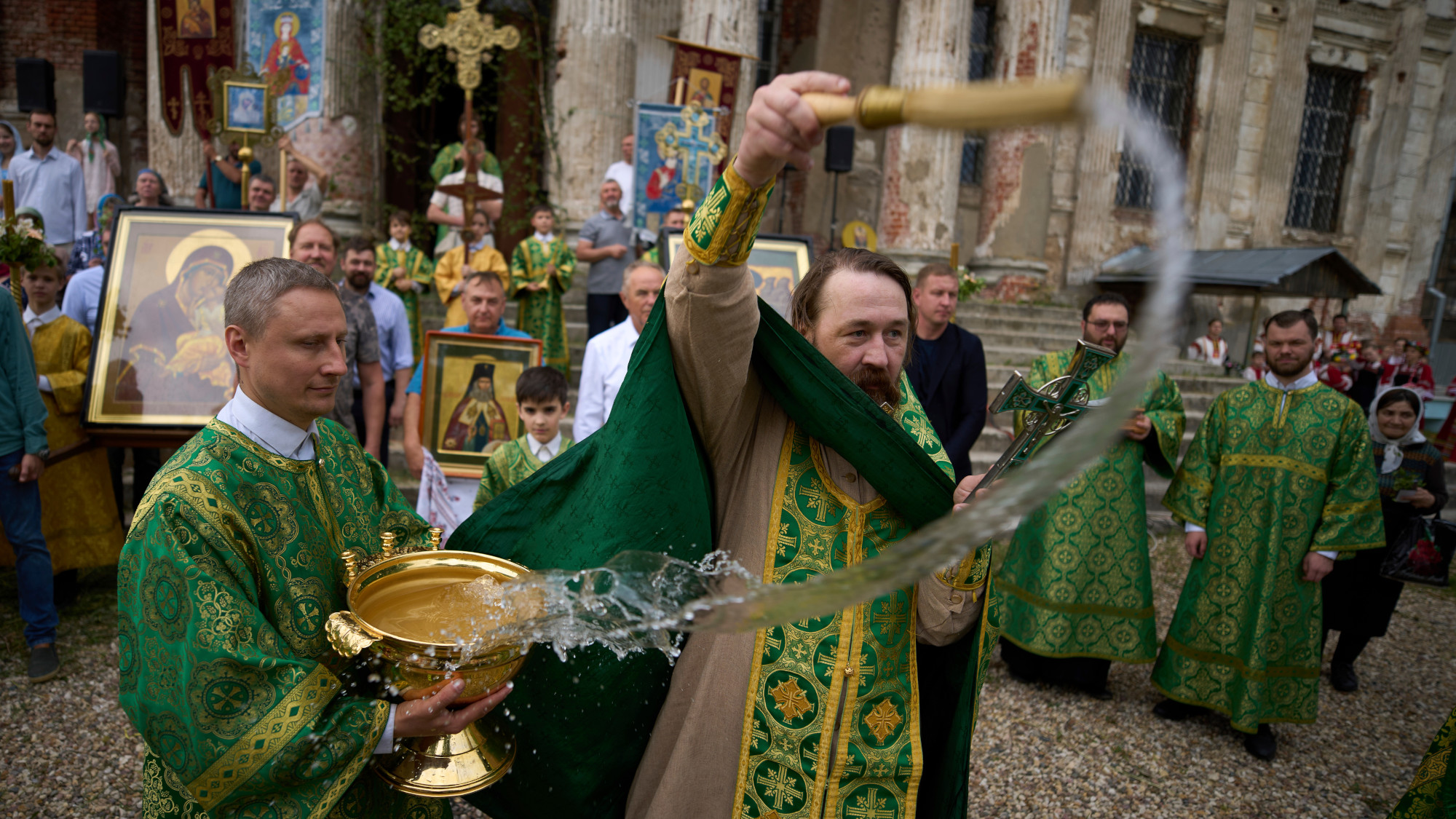 A priest splashes holy water