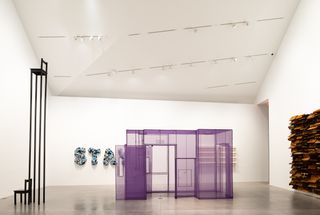White interior of room and purple sculpture