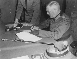 Field Marshal Keitel signs the surrender document in Berlin, on May 8, 1945.