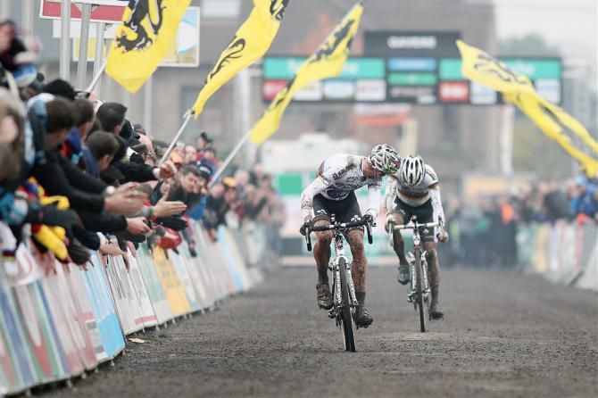 Sven Nys makes sure Philipp Walsleben won't spoil his ensuing victory celebration at Superprestige Gavere