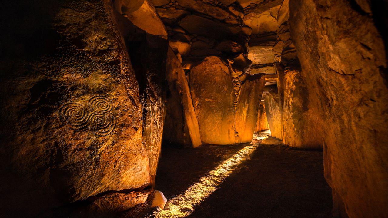 The circular Newgrange passage tomb on a misty morning in Ireland's Boyne Valley. Scientists say it contained the bones of a Neolithic man, probably a king whose parents were brother and sister.