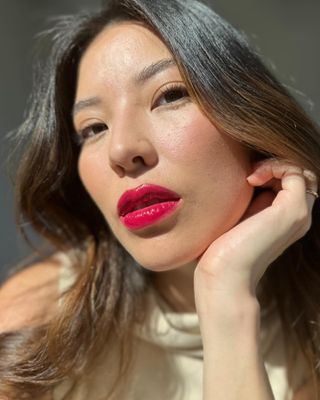 Selfie of a woman wearing bright lipstick.