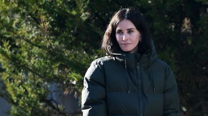 Courteney Cox puffer jacket and jeans outfit