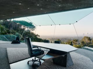 study desk and glazed wall vistas at the Goldstein Entertainment Complex at the sheats-goldstein residence