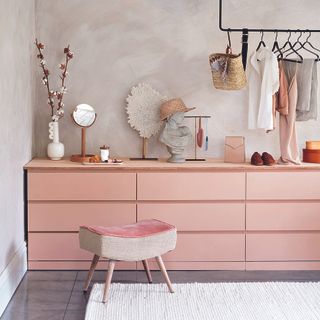 Bedroom dressing table with pink ikea drawers.