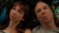 Denise and Stuart stare up at the ceiling while lying down together. 
