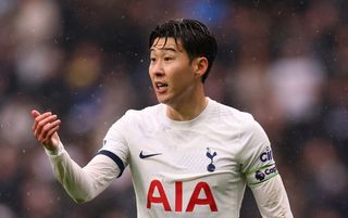 Son Heung-min gestures to a teammate during Tottenham's win over Bournemouth