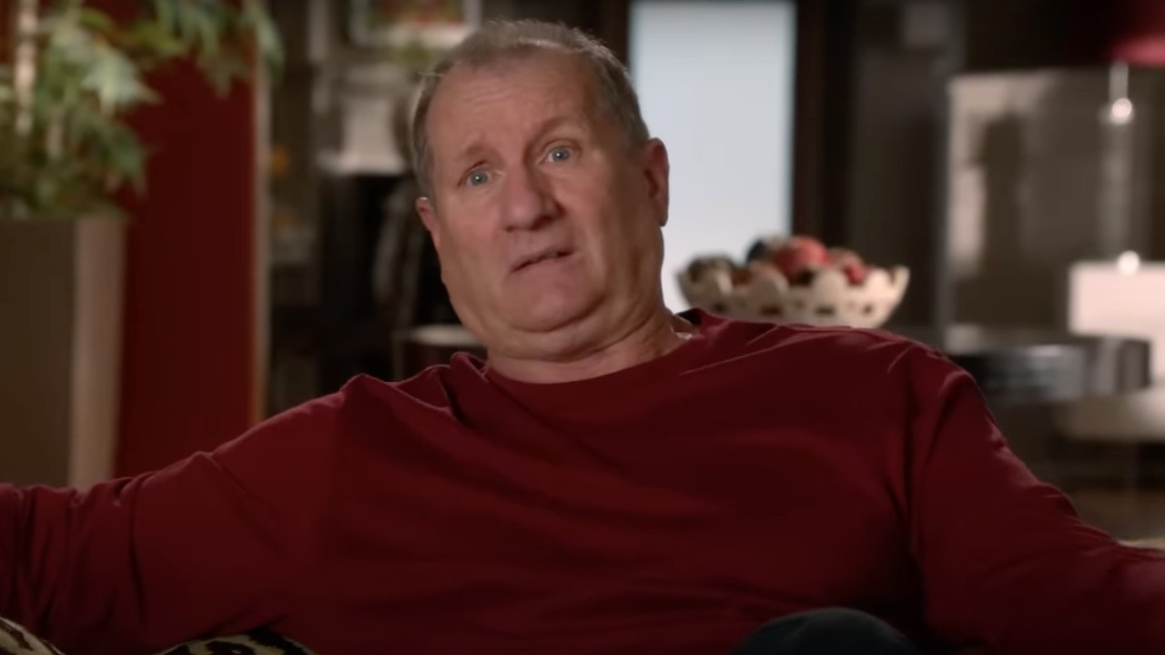 Ed O'Neill in a confessional in Modern Family looking bewildered.