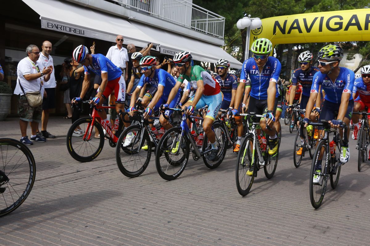 The riders roll out from the start