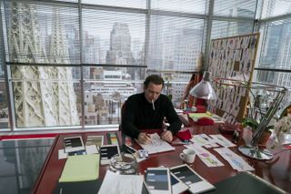 Ewan McGregor as Halston in his red-clad office in Olympic Tower, New York