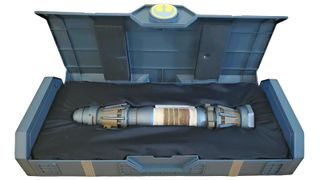 Galaxy’s Edge Rey Skywalker Legacy lightsaber in a display box.