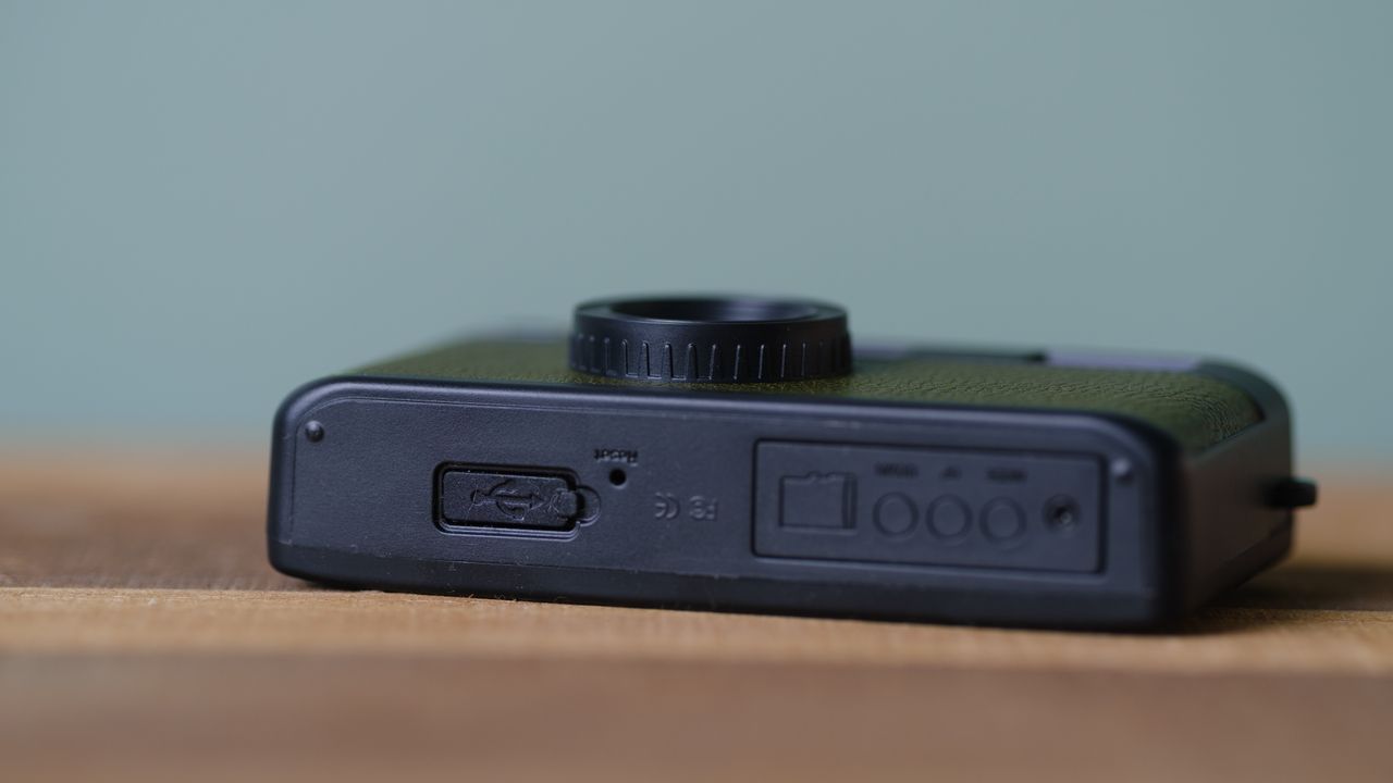 The Camp Snap, in forest green, sits on a table