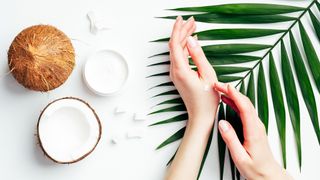 Woman using coconut oil as a moisturiser