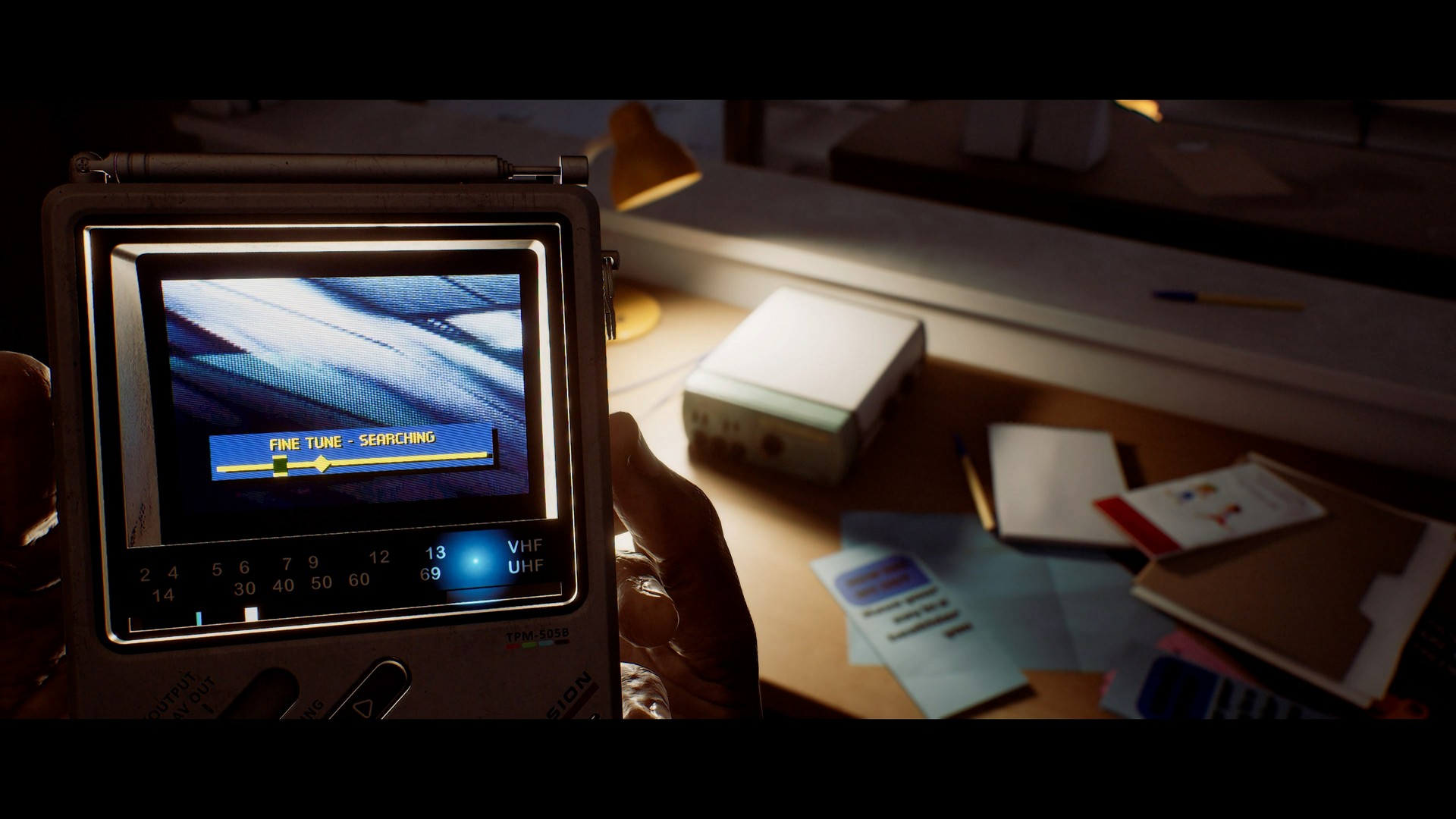 Simon uses a handheld CRTV in Silent Hill Townfall