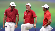 Max Homa, Kevin Kisner and Tiger Woods chat during the TGL match