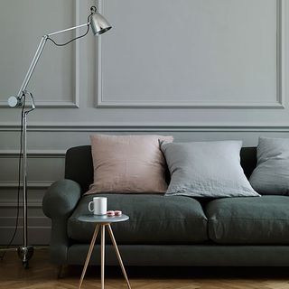 edward bulmer inferior grey living room with sofa cushions and floor lamp