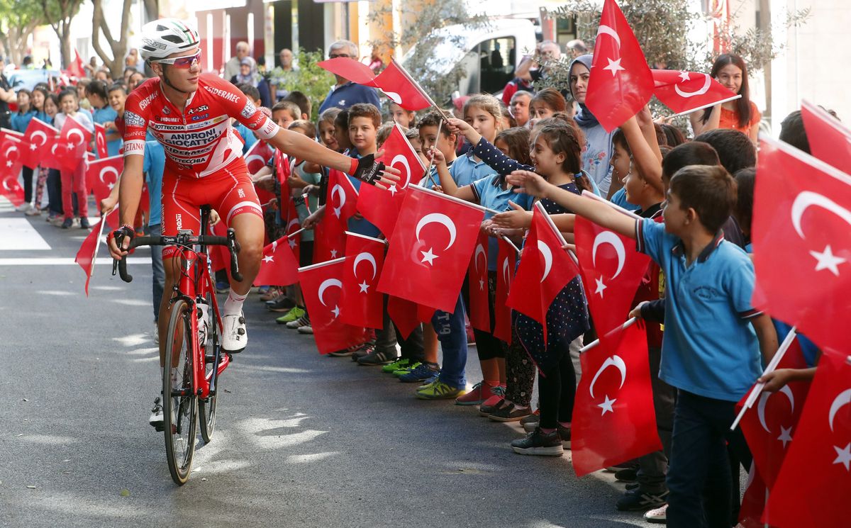 Schoolchildren greet the riders in Turkey