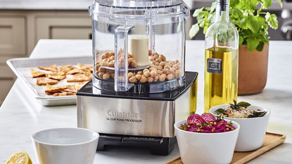 The best food processor brand, the Cuisinart 14-Cup Food Processor chopping chickpeas to make a dip