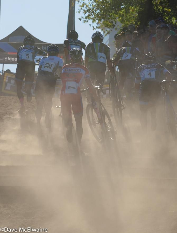 The leaders run the stairs in a cloud of dust