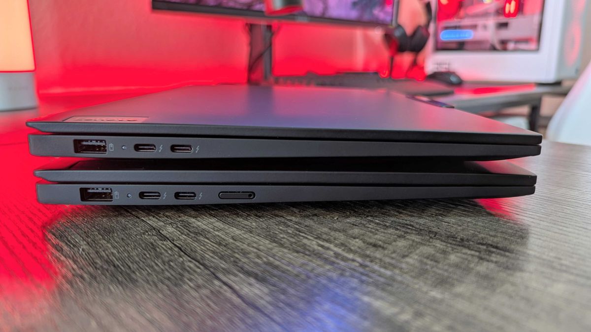 The Lenovo ThinkPad X1 Carbon (Gen 13) Aura Edition sitting on top of the Gen 12, showing the USB Type-A 3.2 Gen 1 port and two USB Type-C Thunderbolt 4 ports.