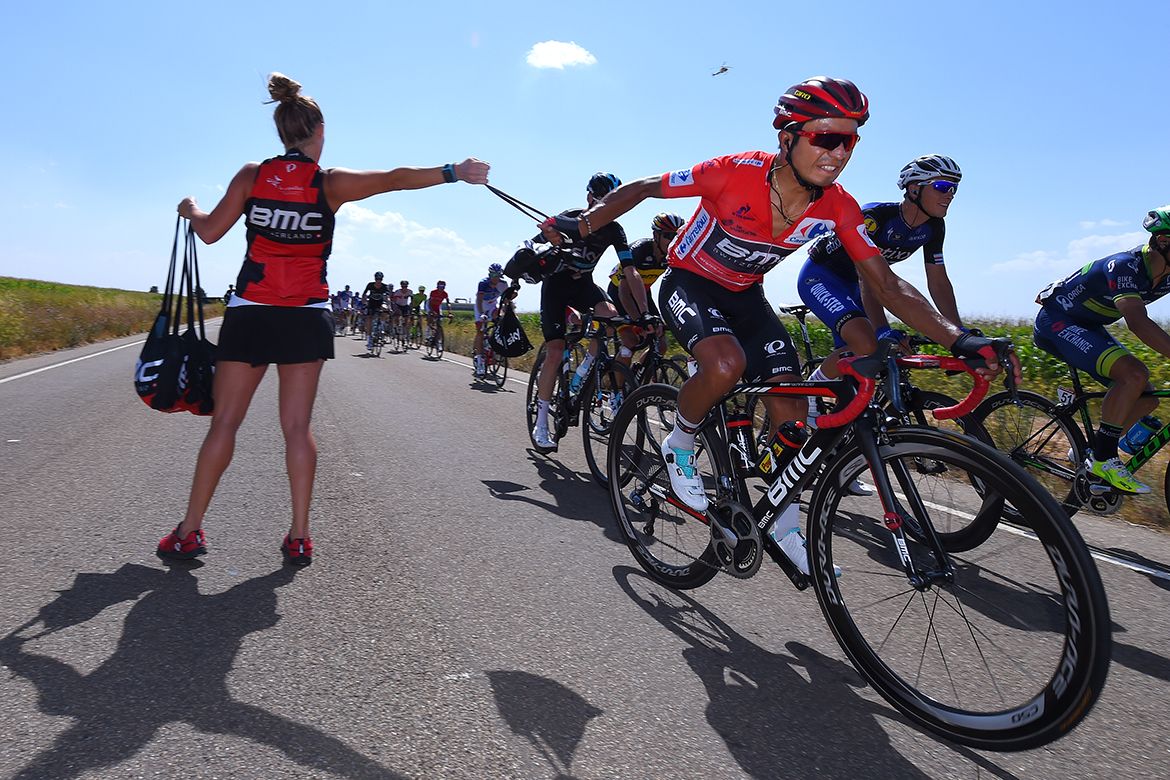 Race leader Darwin Atapuma takes a musette in the feed zone