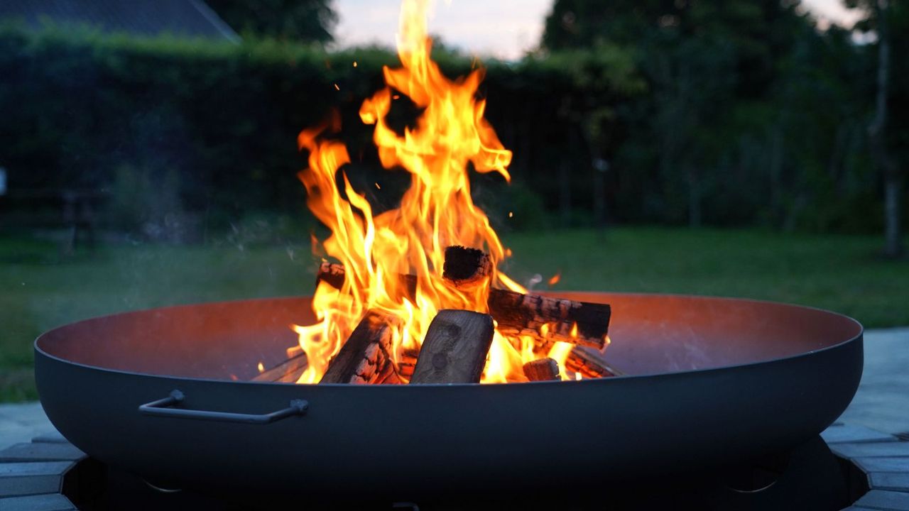 A firepit filled with wood 