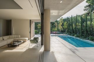 indoor and outdoor relationship and swimming pool at Residence in Dionysos