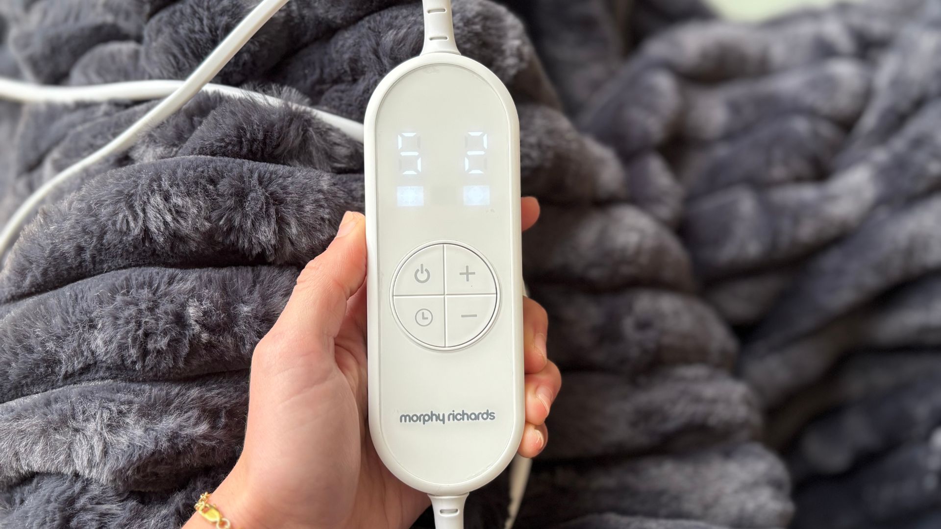 The Morphy Richards EverCosy Heated Throw on a chair, being tested for our review
