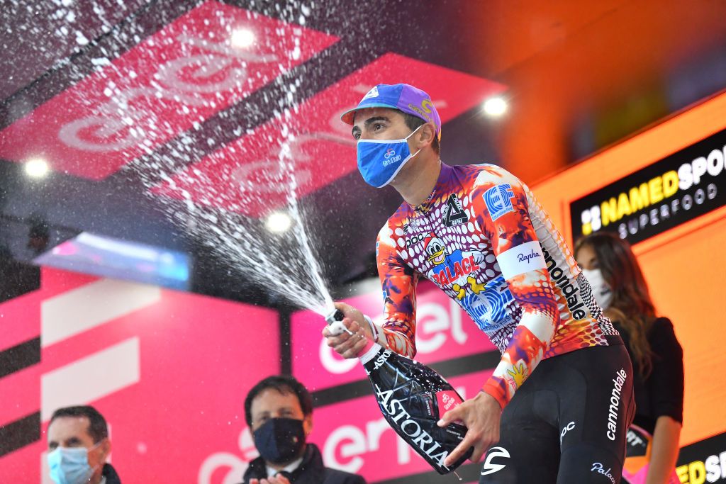 ROCCARASO ITALY OCTOBER 11 Podium Ruben Guerreiro of Portugal and Team EF Pro Cycling Celebration Champagne during the 103rd Giro dItalia 2020 Stage 9 a 207km stage from San Salvo to Roccaraso Aremogna 1658m girodiitalia Giro on October 11 2020 in Roccaraso Italy Photo by Stuart FranklinGetty Images