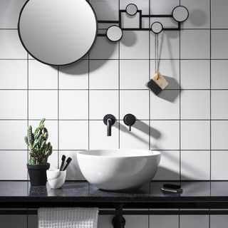 bathroom with tiles and mirror