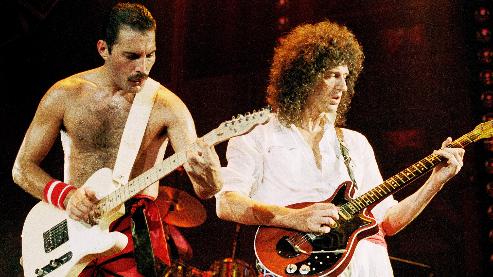 Photo of QUEEN, Freddie Mercury and Brian May performing on stage September 1984