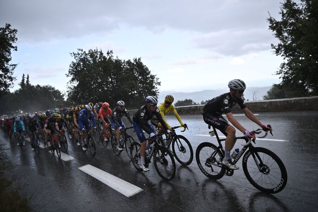 TOPSHOT The pack rides under a heavy rain during the 3rd stage of the 107th edition of the Tour de France cycling race 198 km between Nice and Sisteron on August 31 2020 Photo by Marco BERTORELLO AFP Photo by MARCO BERTORELLOAFP via Getty Images