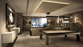 a modern and luxurious home cinema and games room, with a pool table, bar and sofas
