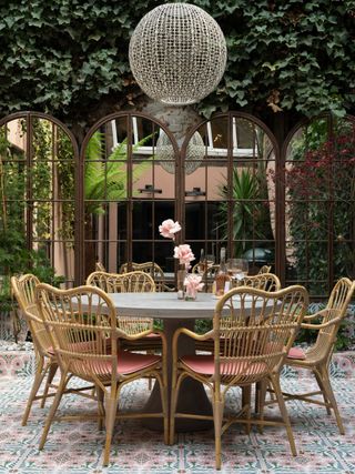 an outdoor dining table with mirrors